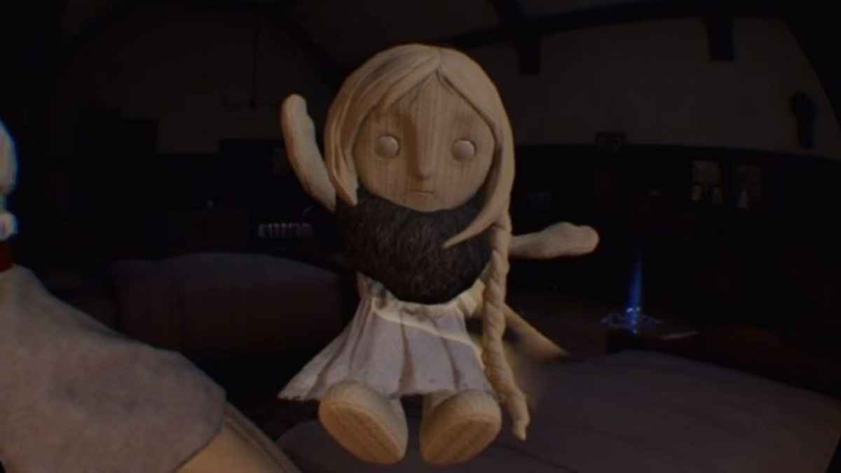 Screenshot della misteriosa bambola di Bloodborne all'interno di Déraciné