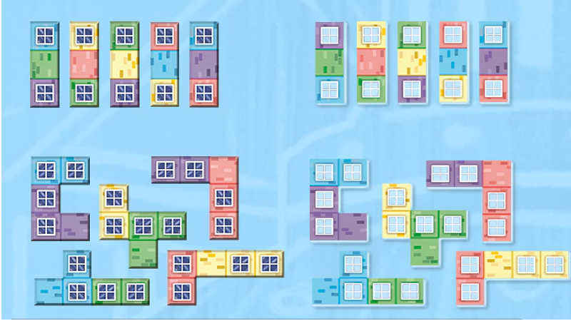 confronto tra le tile dell'edizione standard e quelle dell'edizione deluxe, stampate in cartoncino da 3 mm con colore acrilico e finestrelle in trasparenza