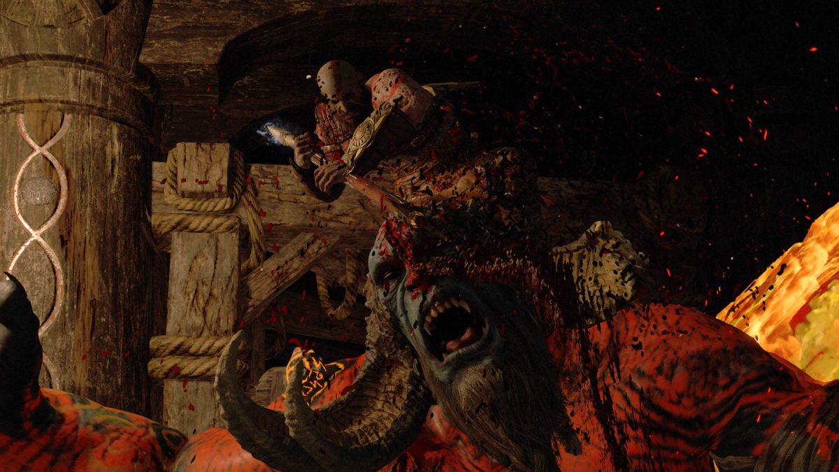 Kratos che uccide un gigante in modo splatter