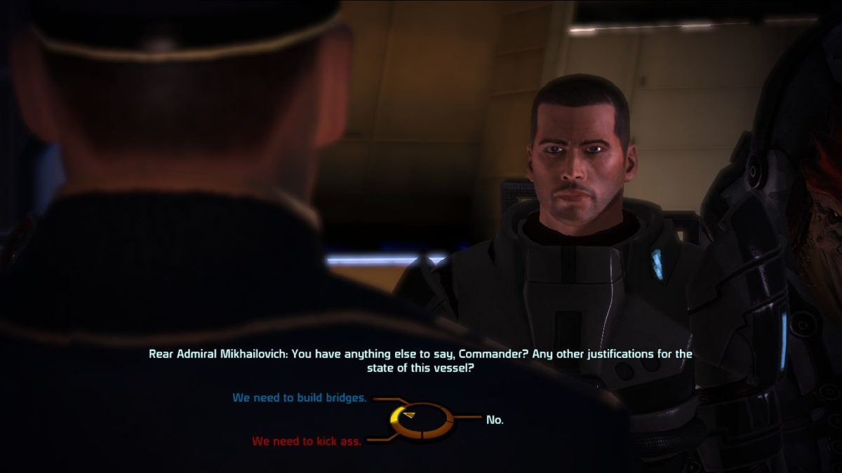 Immagine proveniente dal gioco Mass Effect raffigurante un dialogo in cui al giocatore è posta una scelta tra tre opzioni disposte in un cerchio facilmente navigabile con un controller.