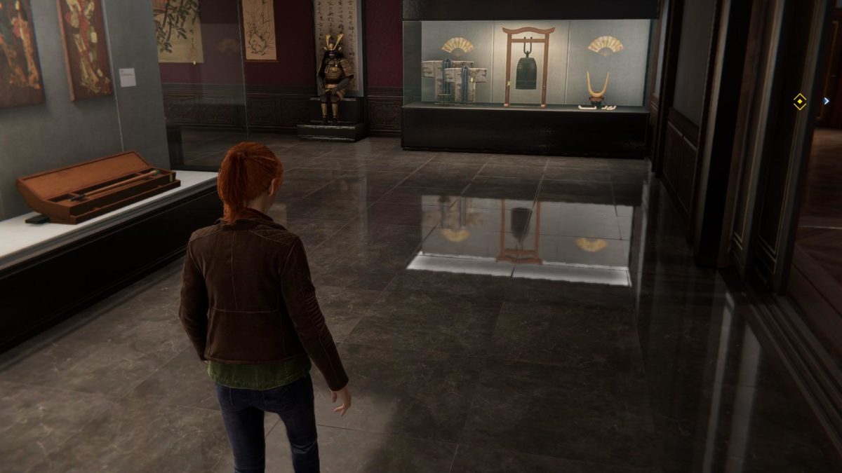 Mary jane all'interno di un museo. Uno degli stand è riflesso completamente sul pavimento lucido in marmo.