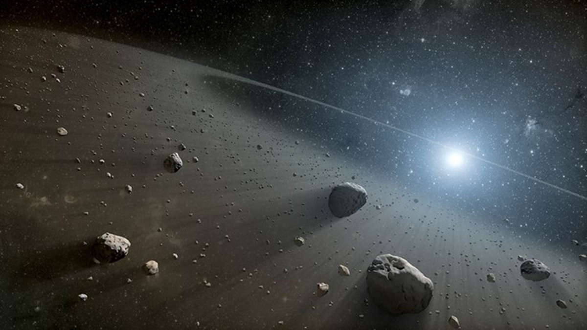 Sciame di asteroidi che attraversa un orbita