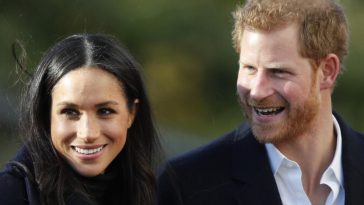 Harry e Meghan sorridono