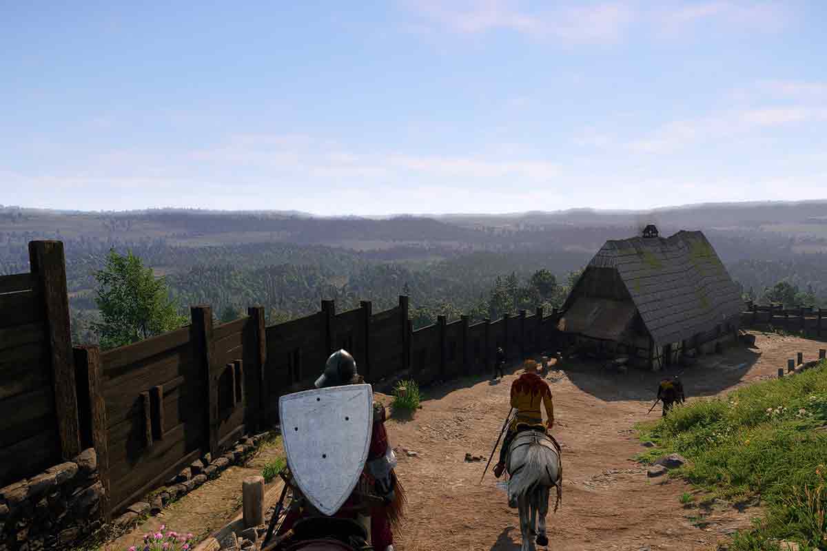 Henry e Ser Hans capon cavalcano giù da un forte con il paesaggio sconfinato delle foreste Boeme