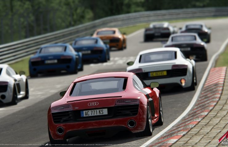 screenshot di assetto corsa con auto da corsa sulla griglia di partenza di una pista