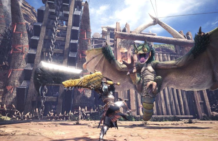 screenshot di Monster Hunter World dove un cacciatore sta affrontando una bestia alata in una città in rovina
