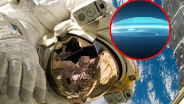 Astronauta nello spazio e in evidenza un UFO