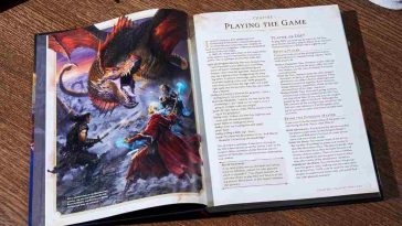 manuale del giocatore di dungeon and dragons aperto sul tavolo con spade e dadi intorno