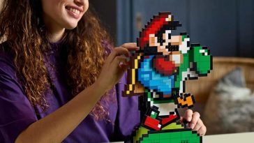 ragazza gioca con set lego mario e yoshi