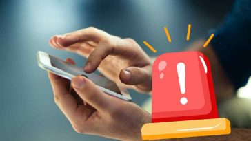 mani che usano smartphone e sirena di pericolo