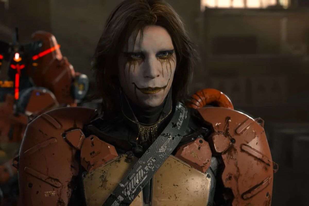 higgs di death stranding con viso truccato di bianco e trucco sbavato