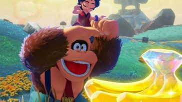 Donkey Kong sorpreso che guarda una gemma di Banandium sullo sfondo del livello della Collina