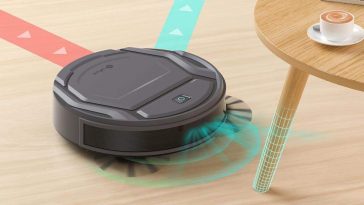 lefant aspirapolvere che si muove sul pavimento e si avvicina alla gamba di un tavolo