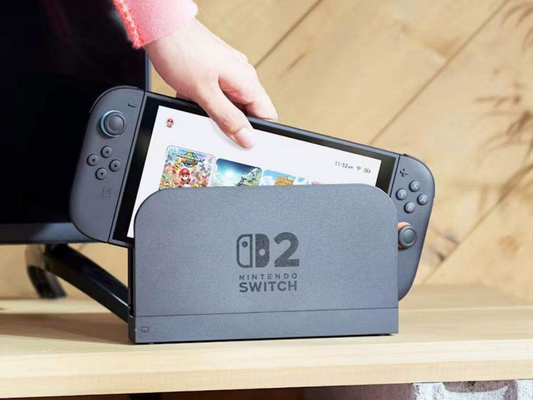 nintendo switch 2 che viene infilata in dock di ricarica