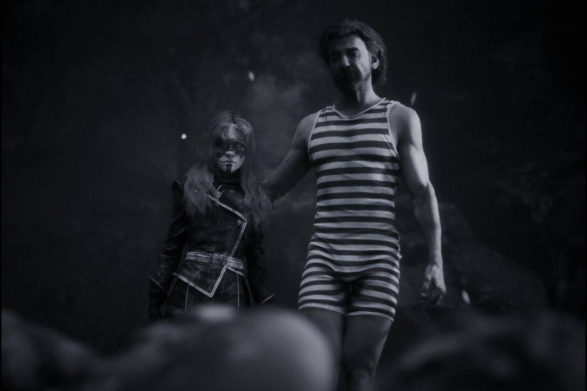 renoir con costume da bagno al fianco di ragazza con maschera bianca