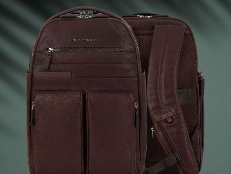 zaino Piquadro fronte retro su sfondo verde scuro