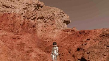 Un astronauta su un terreno rosso simile a Marte
