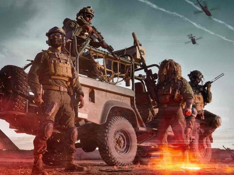 soldati in piedi e sedut su una camionetta, esplosione alle spalle