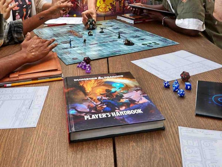 manuale giocatore su tavolo di legno, tabellone di gioco