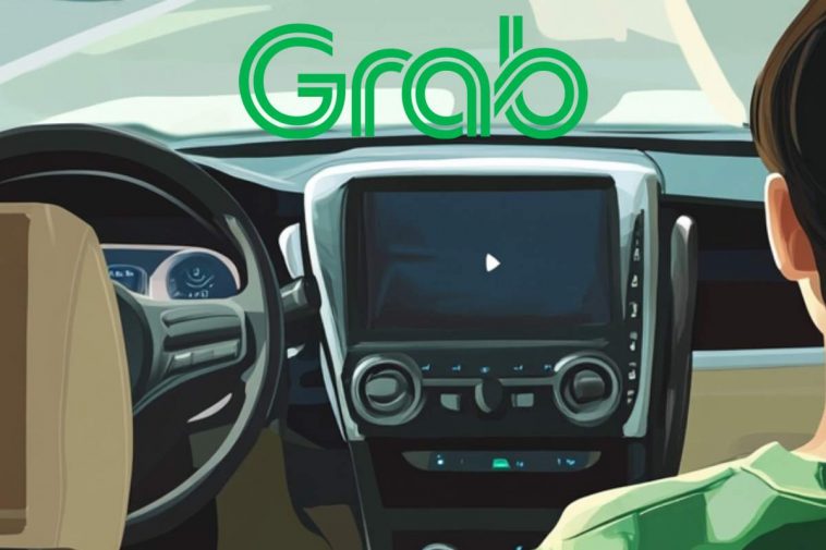 Un taxi a guida autonoma e il marchio dell'azienda Grab