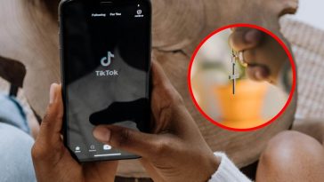 TikTok su un telefono e, in evidenza, delle mani con un rosario
