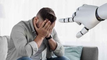 uomo che si vergogna e mano robot che lo indica