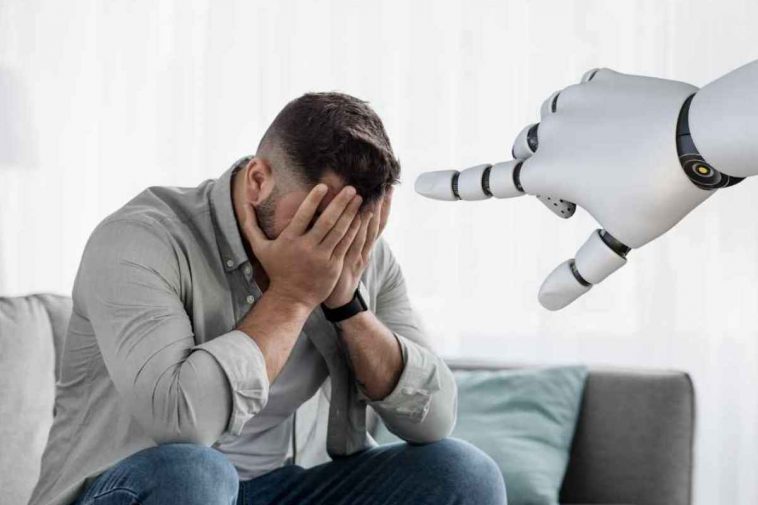 uomo che si vergogna e mano robot che lo indica