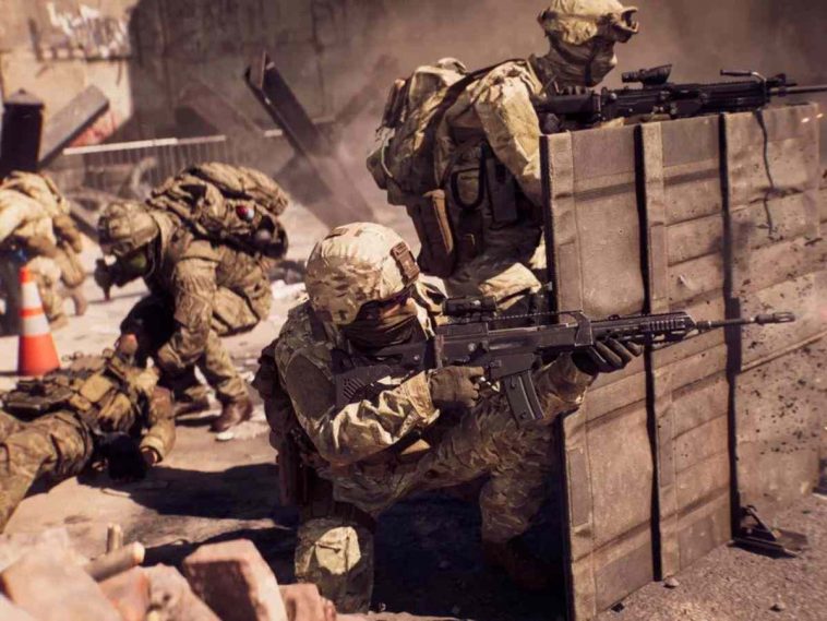 soldati con fucili schierati dietro muro di legno