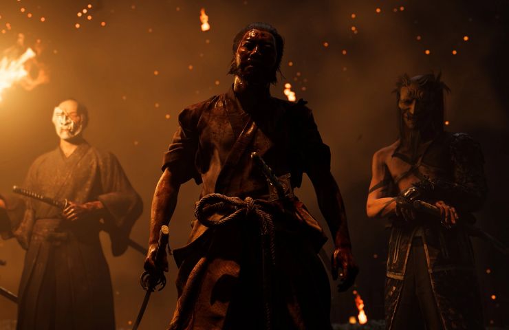 ghost of yotei screenshot con samurai mascherati tra le fiamme