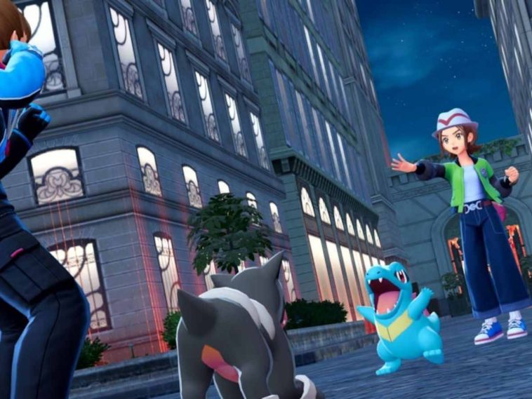 leggende pokemon za scena di lotta tra totodile e houndour