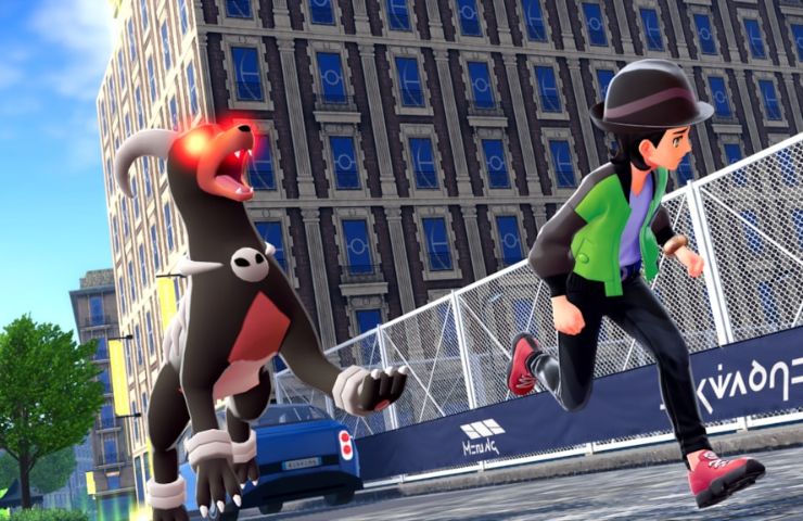 screenshot di leggende z-a con allenatore che fugge da Houndoom alfa