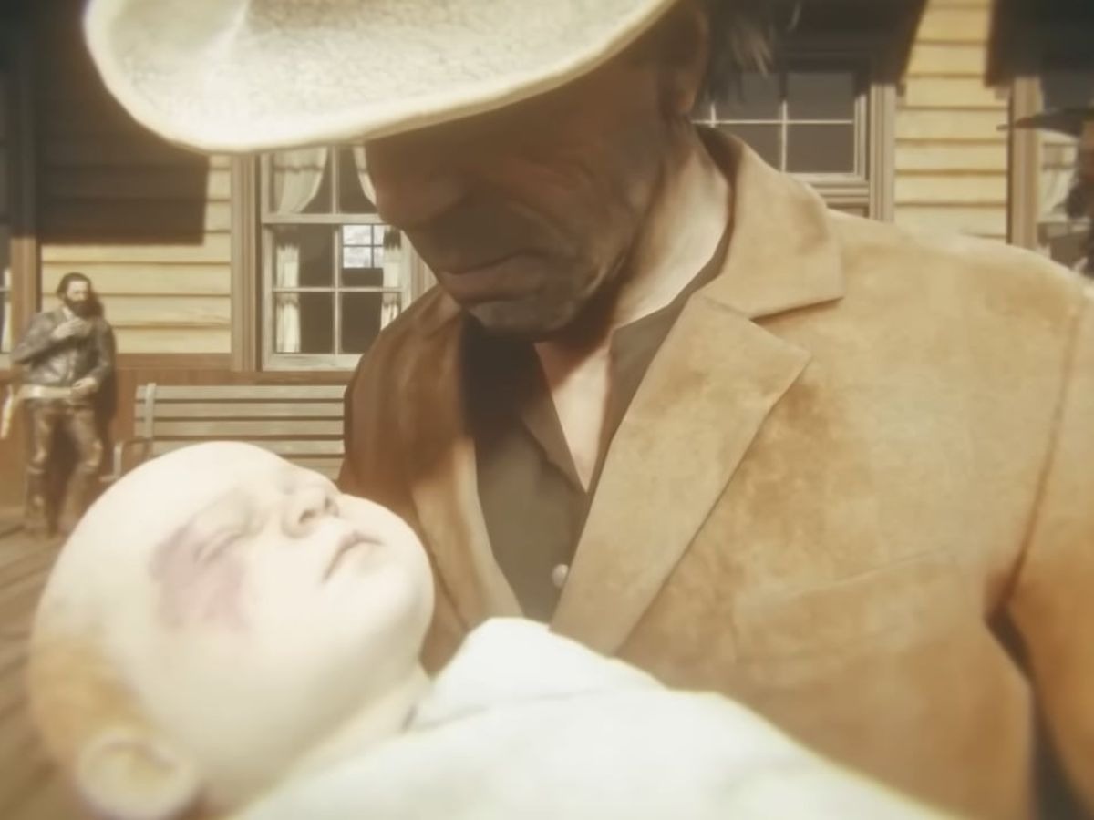 uomo con cappello da cowboy che tiene in braccio neonato