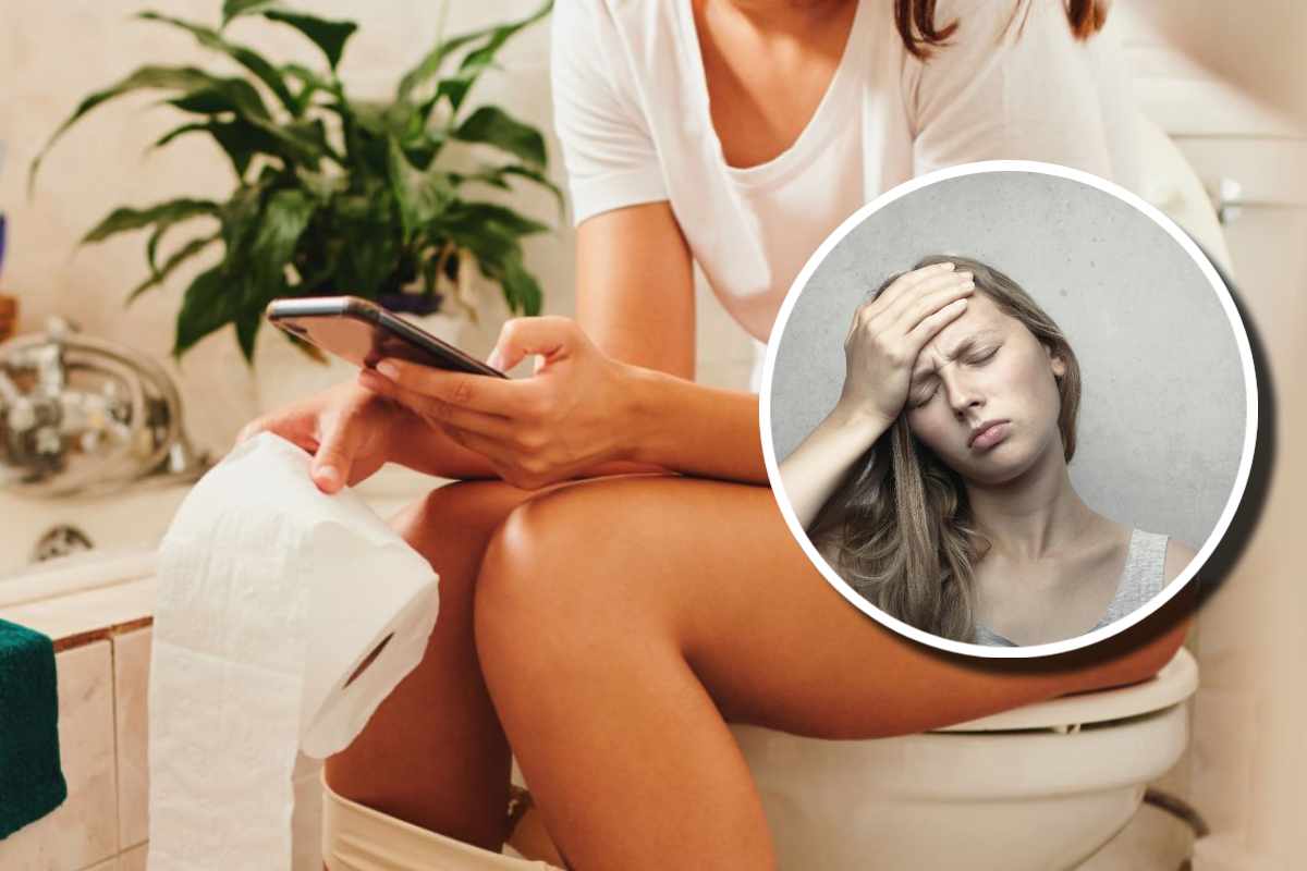 Una ragazza in bagno con in mano un telefono e in un'altra la carta igienica e, in evidenza, una faccia sofferente