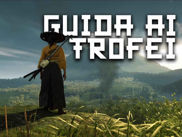 donna n abito giallo tipico giapponese medievale, cappello di paglia su prato, scritta guid ai trofei