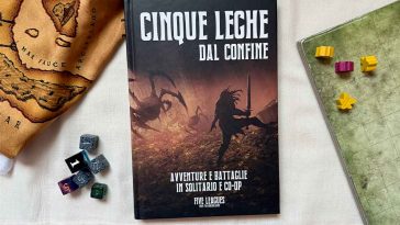 Manuale di Cinque Leghe dal Confine con miniature, dadi e mappe attorno