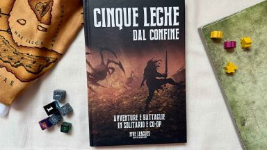 Manuale di Cinque Leghe dal Confine con miniature, dadi e mappe attorno
