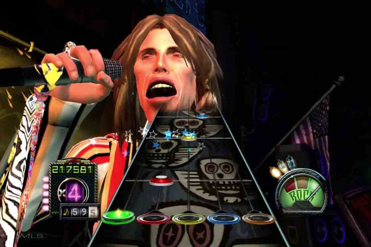 steven tyler capelli lunghi microfono, manico di chitarra con bottoni gialli, verdi blu