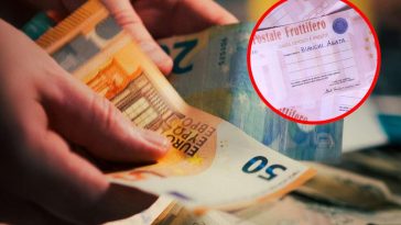 Delle mani che contano degli euro e in evidenza un vecchio buono fruttifero postale