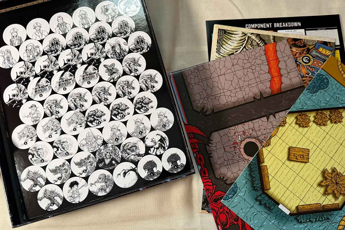 Le pedine in bianco e nero, stile anni 80, e le mappe all'interno dello starter set