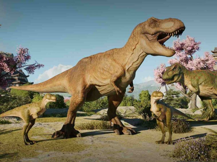 screenshot di Jurassic World Evolution con tirannosauro in primo piano