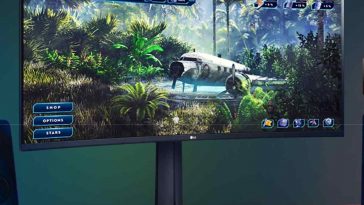 monitor da gaming Ultragear curvo 34" su postazione con casse