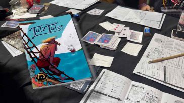 La copertina di Tall Tales con lo sfondo il tavolo di gioco