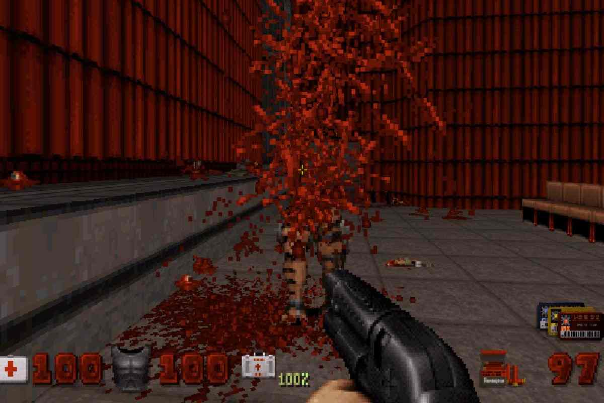 visione prima persona d duke nukem con fucile a pompa che spara a mostro che esplode