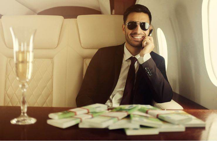 Miliardario a bordo di un aereo