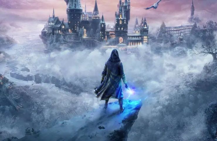 immagine chiave di Hogwarts Legacy con mago su precipizio di fronte a castello di Hogwarts