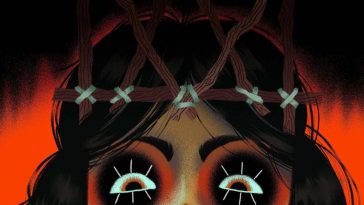 VIso ragazza con trucco nero attorno a occhi e corna fatte con rami