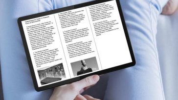 persona legge articolo di giornale su tablet messo su gambe